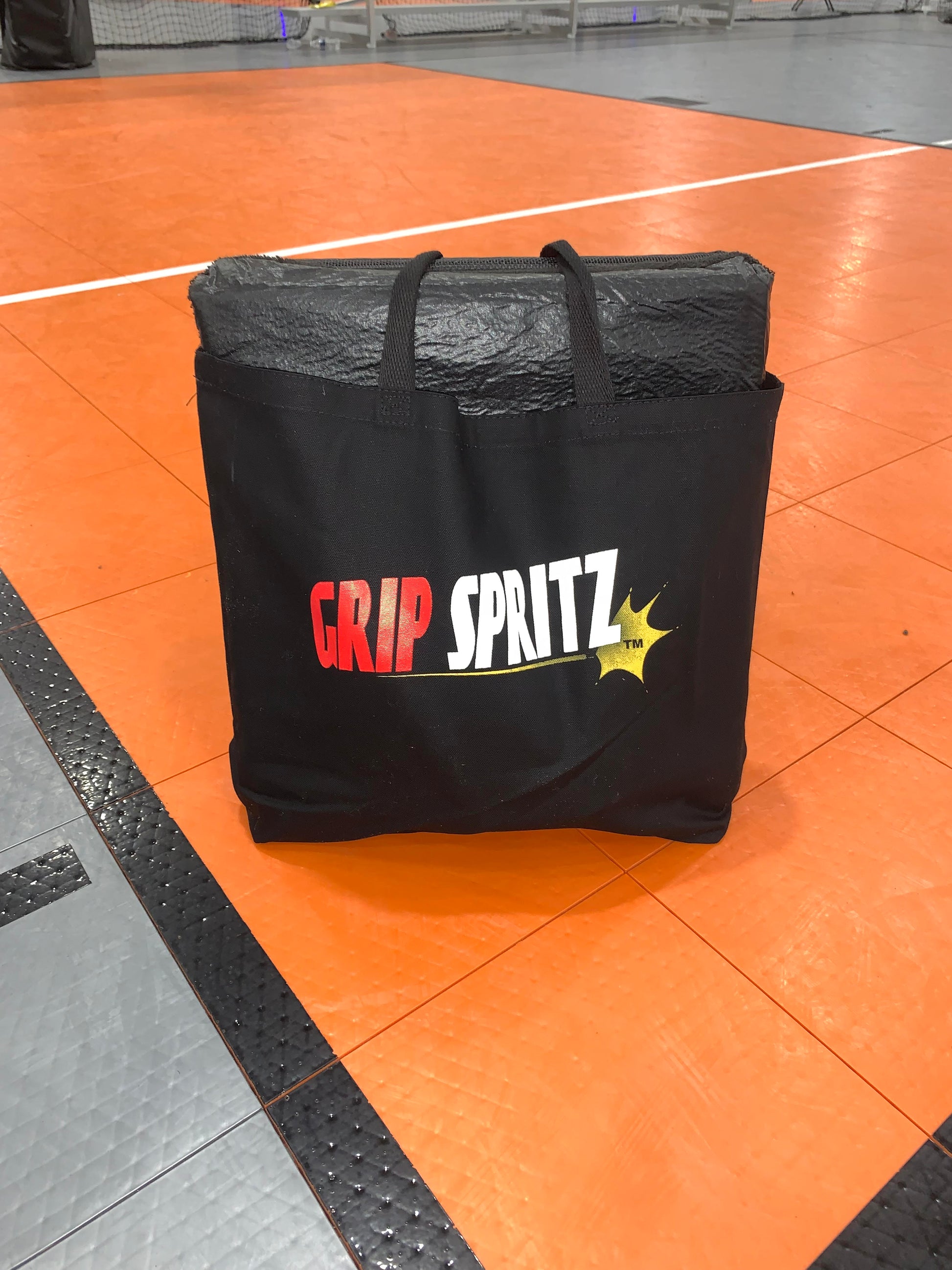 Grip Spritz Basketball Traction Pad in a tote bag